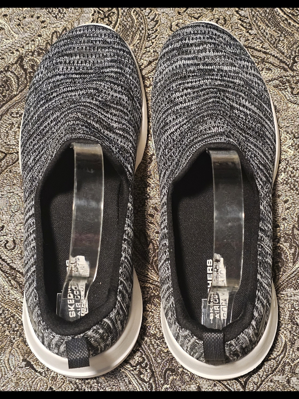Skechers Women’s Slip-On Knit Sneakers in Black and White